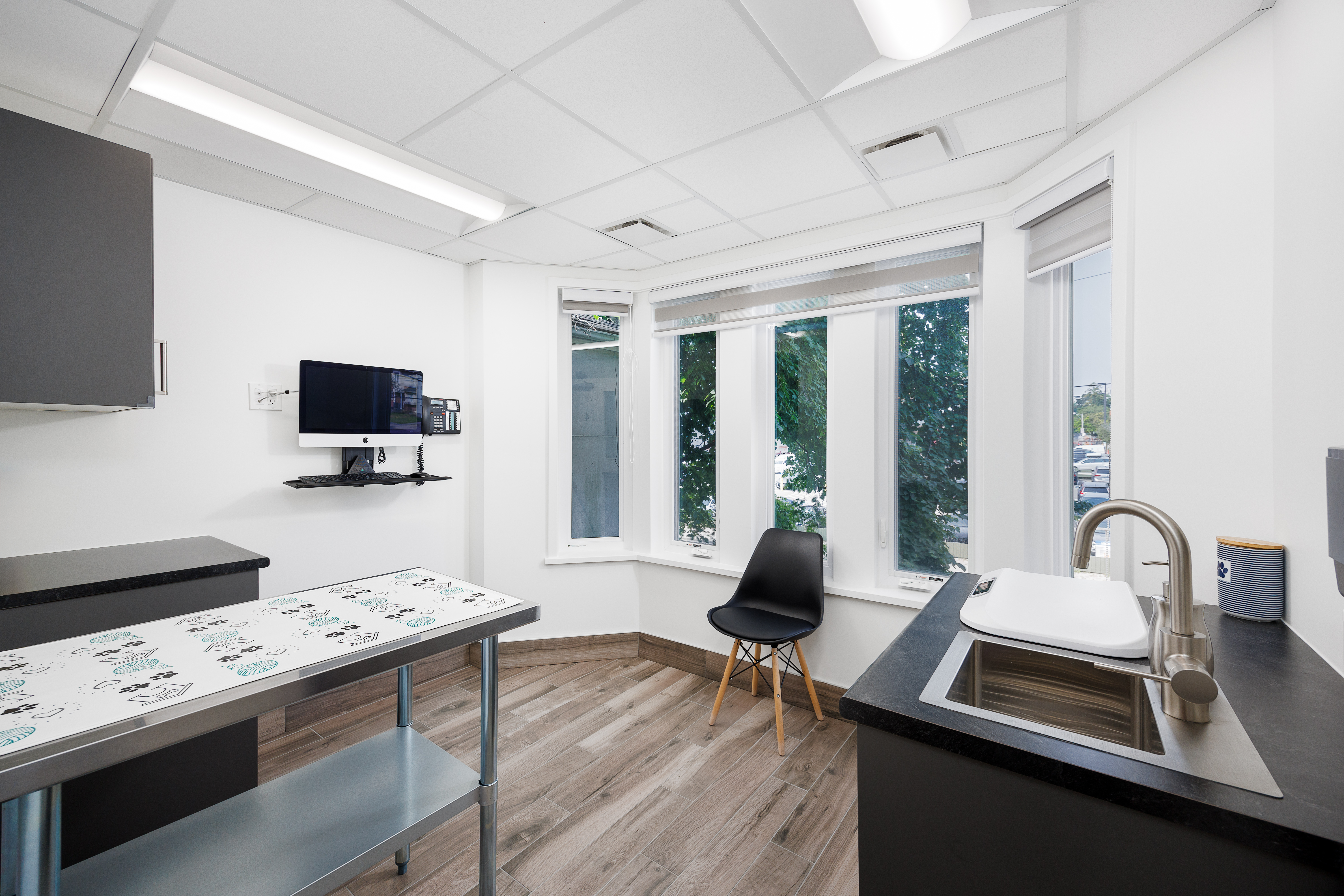 The image shows an interior space that appears to be a modern kitchen with a breakfast bar, countertops, and various appliances.